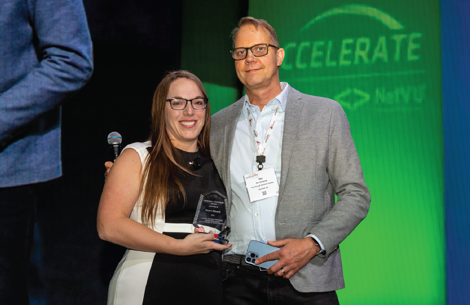 Pictured: NetVU Conference Steering Committee Chairman Jessica Jeffress and Brent Rineck's husband Dan Wickering who accepted Brent's award (posthumously) on his behalf.